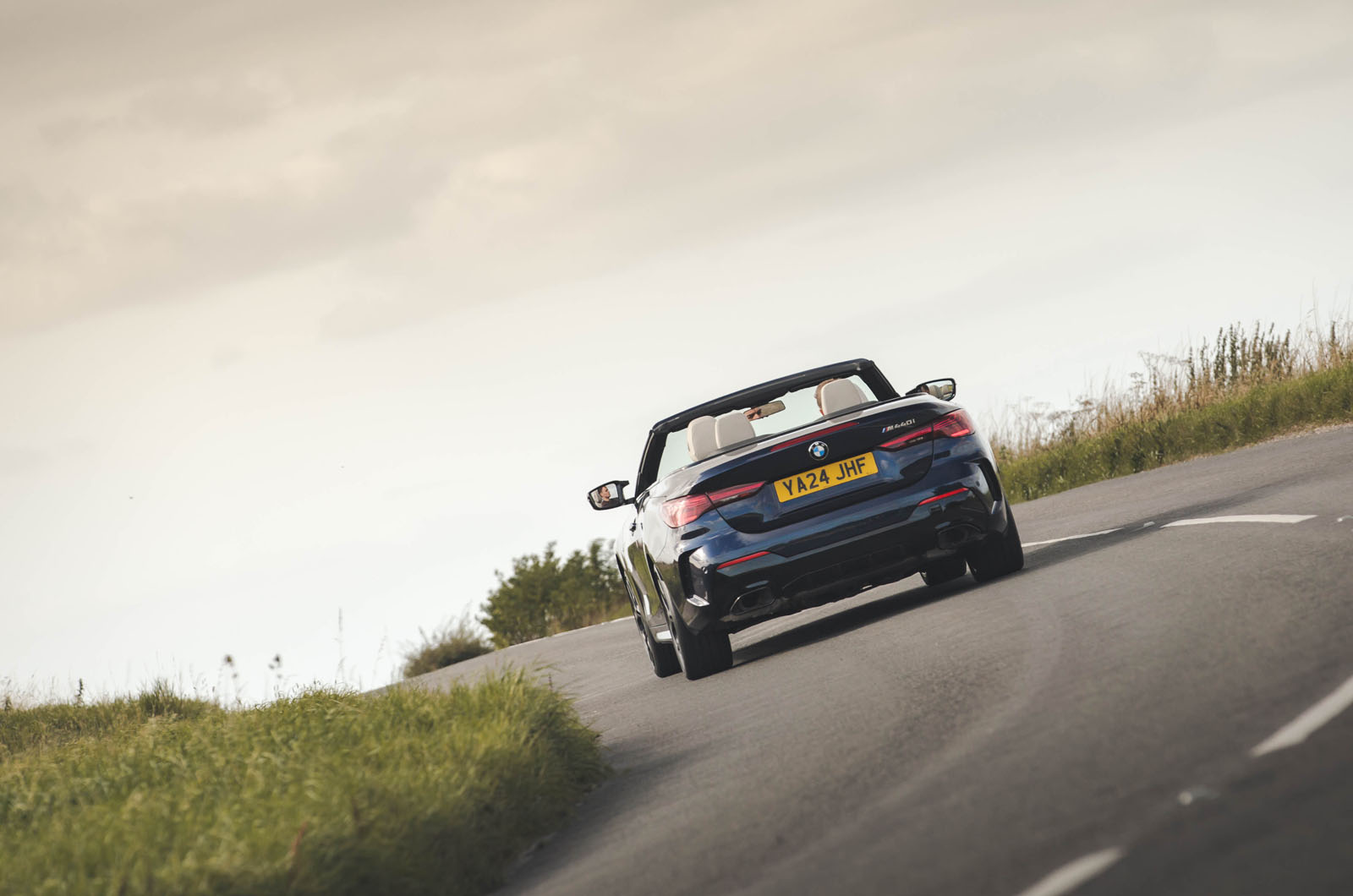 BMW M440i Cabriolet in blue   cornering rear