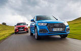 Audi Q5 leading Volvo XC60 