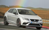 Seat Leon Cupra 300 with a rainbow above it