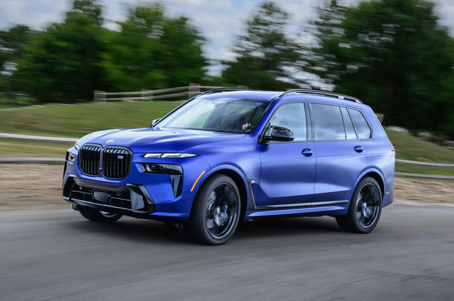 BMW X7 driving three quarters side