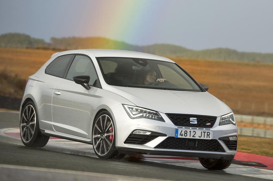 Seat Leon Cupra 300 with a rainbow above it